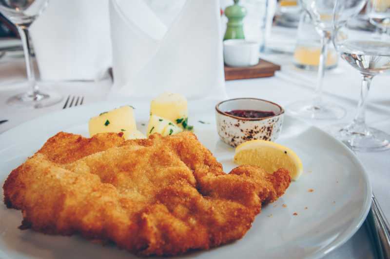 Viennese Schnitzel with potatoes cranberries and lemon