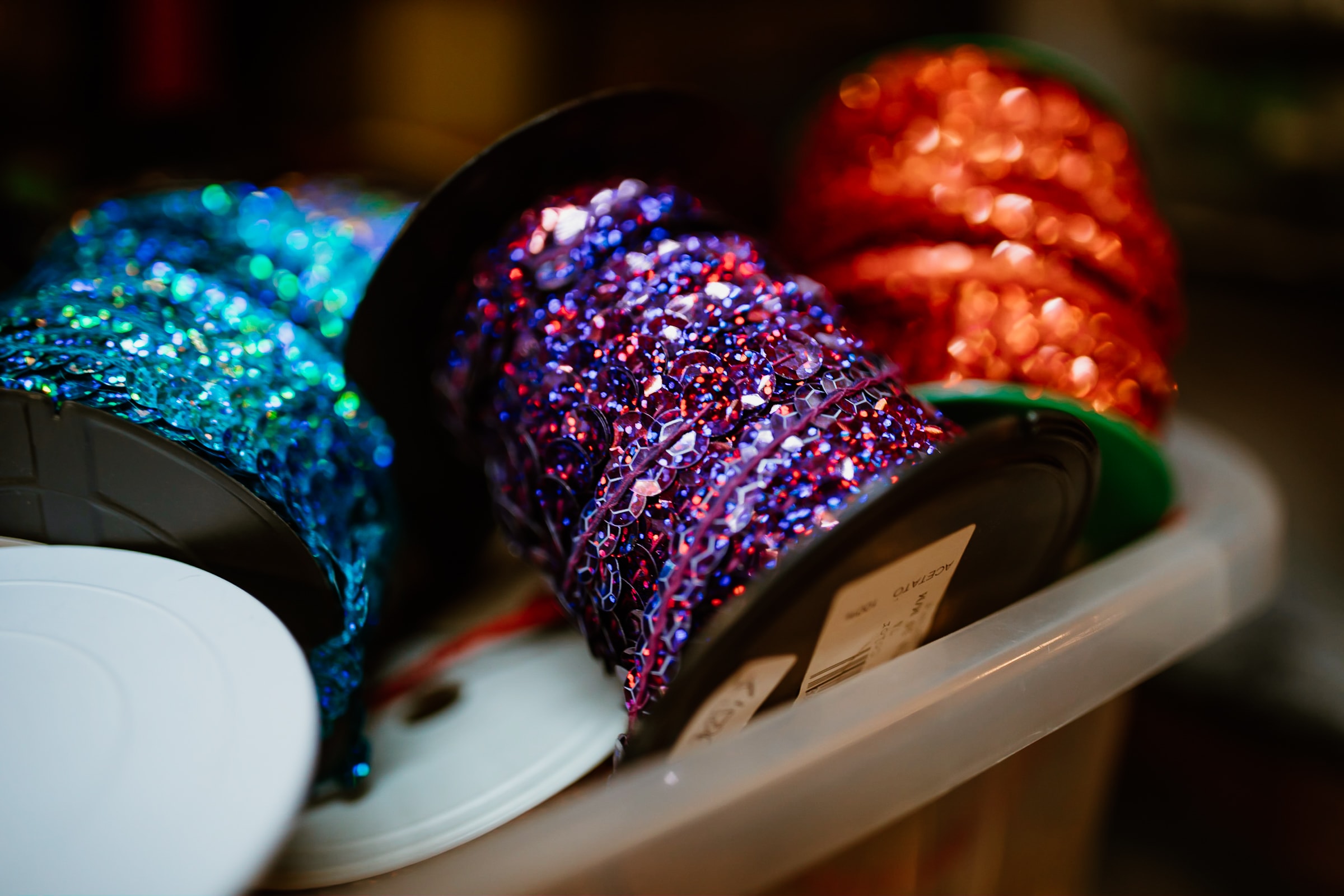 sequin ribbons on spools in a box