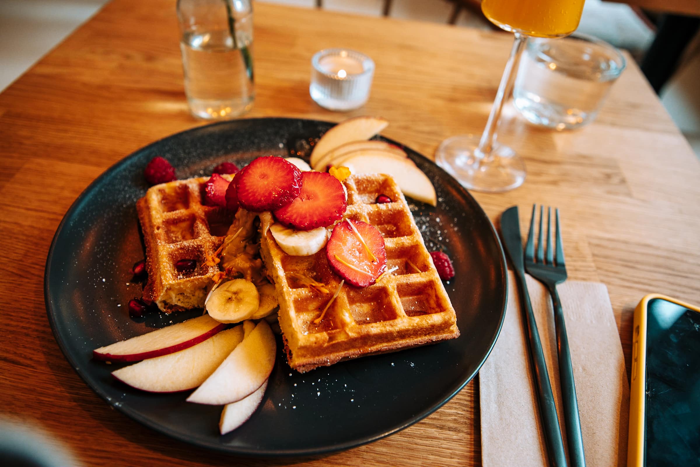 Waffles with fruit at Mimosas Brunch Club in Hamburg