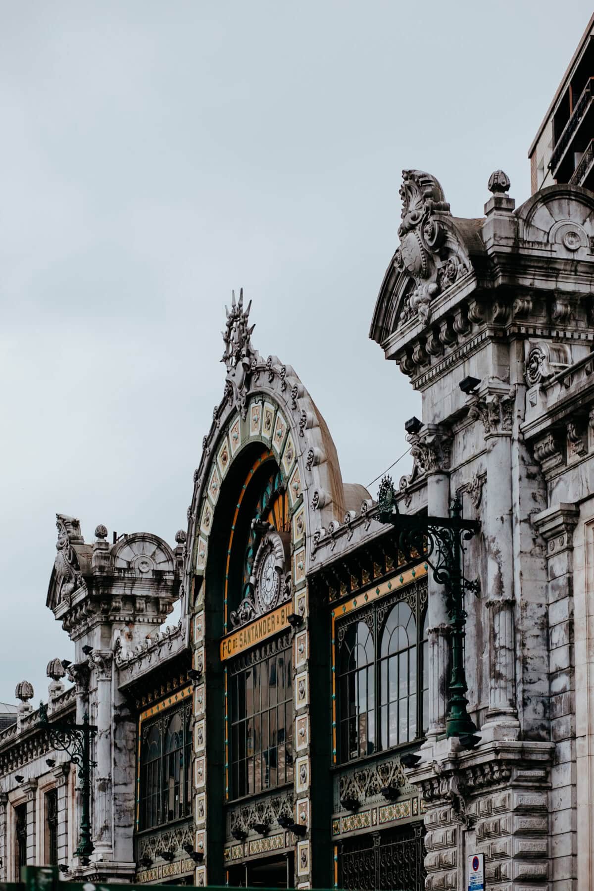 Ornate station entrance with artistic sculptures.