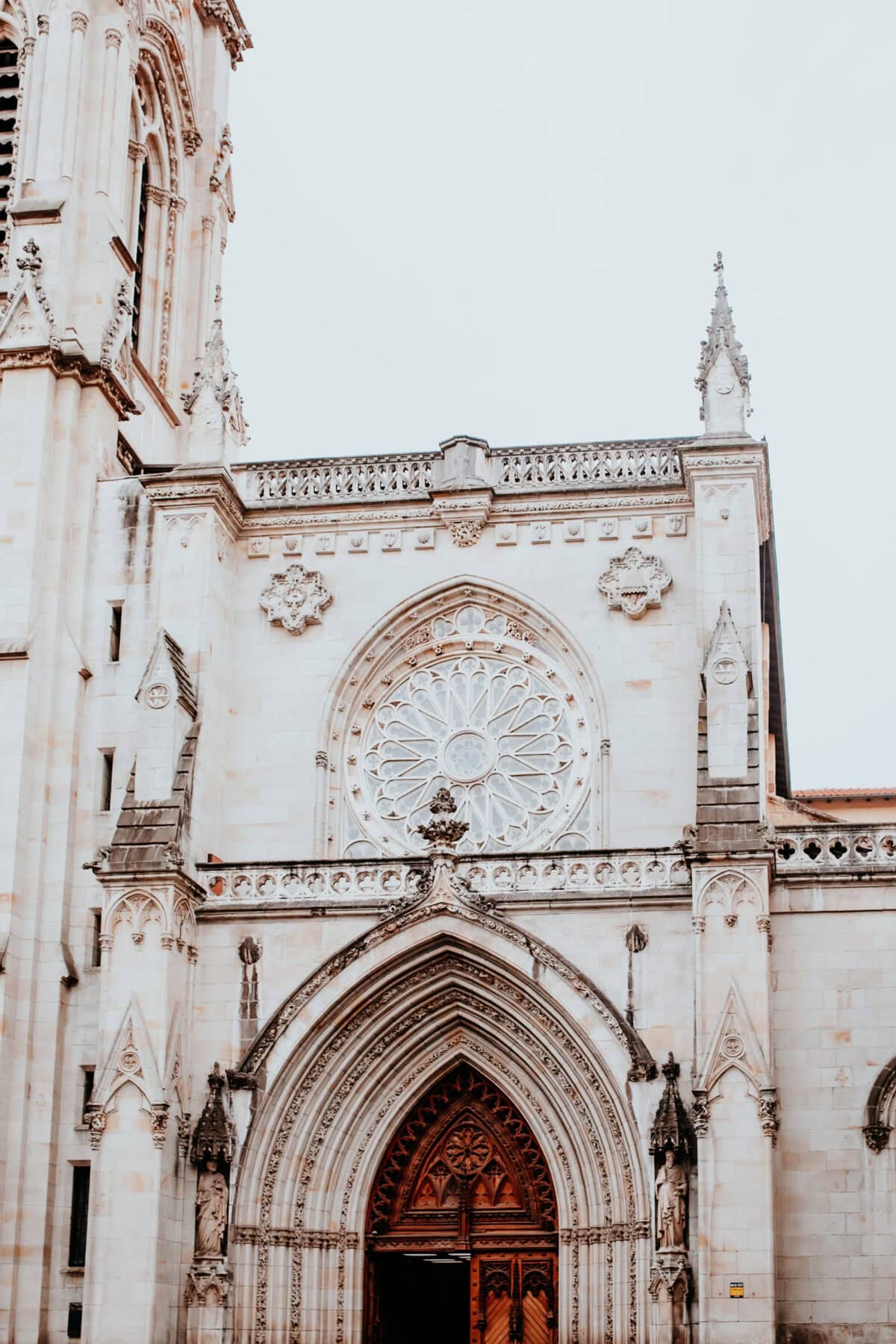 Gothic cathedral façade with rose windows.