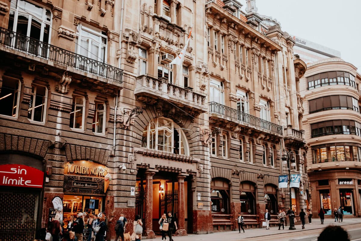Lively street scene with historic buildings in the city.