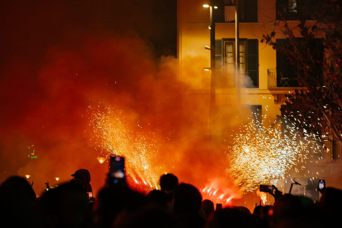 Fireworks at night in a crowd