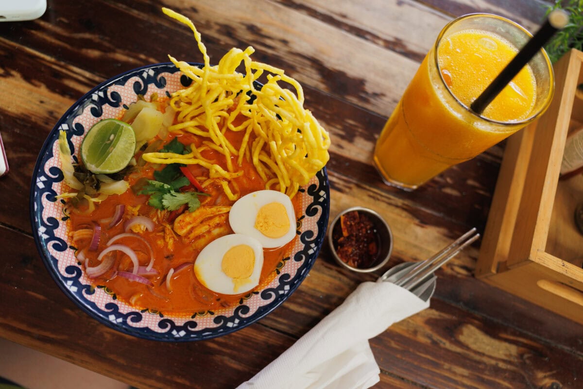 Thai noodle soup with egg and crispy noodles