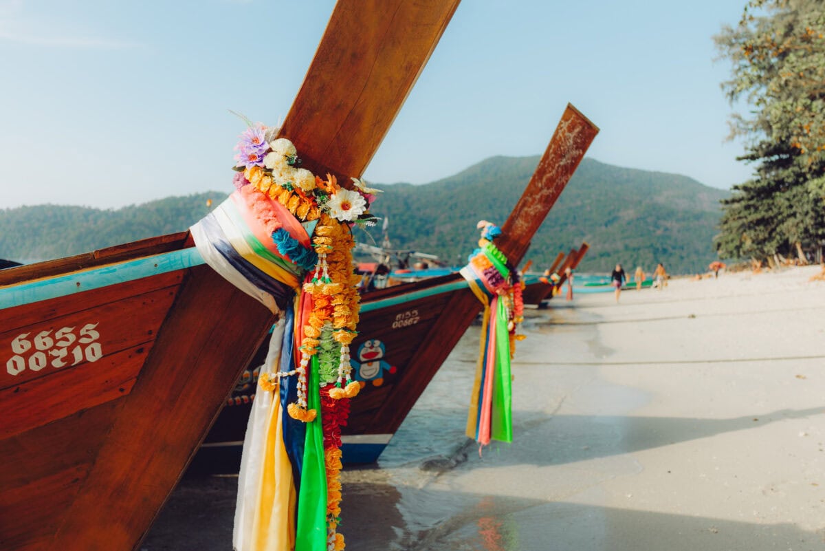 Colorful longtail boats on a tropical beach