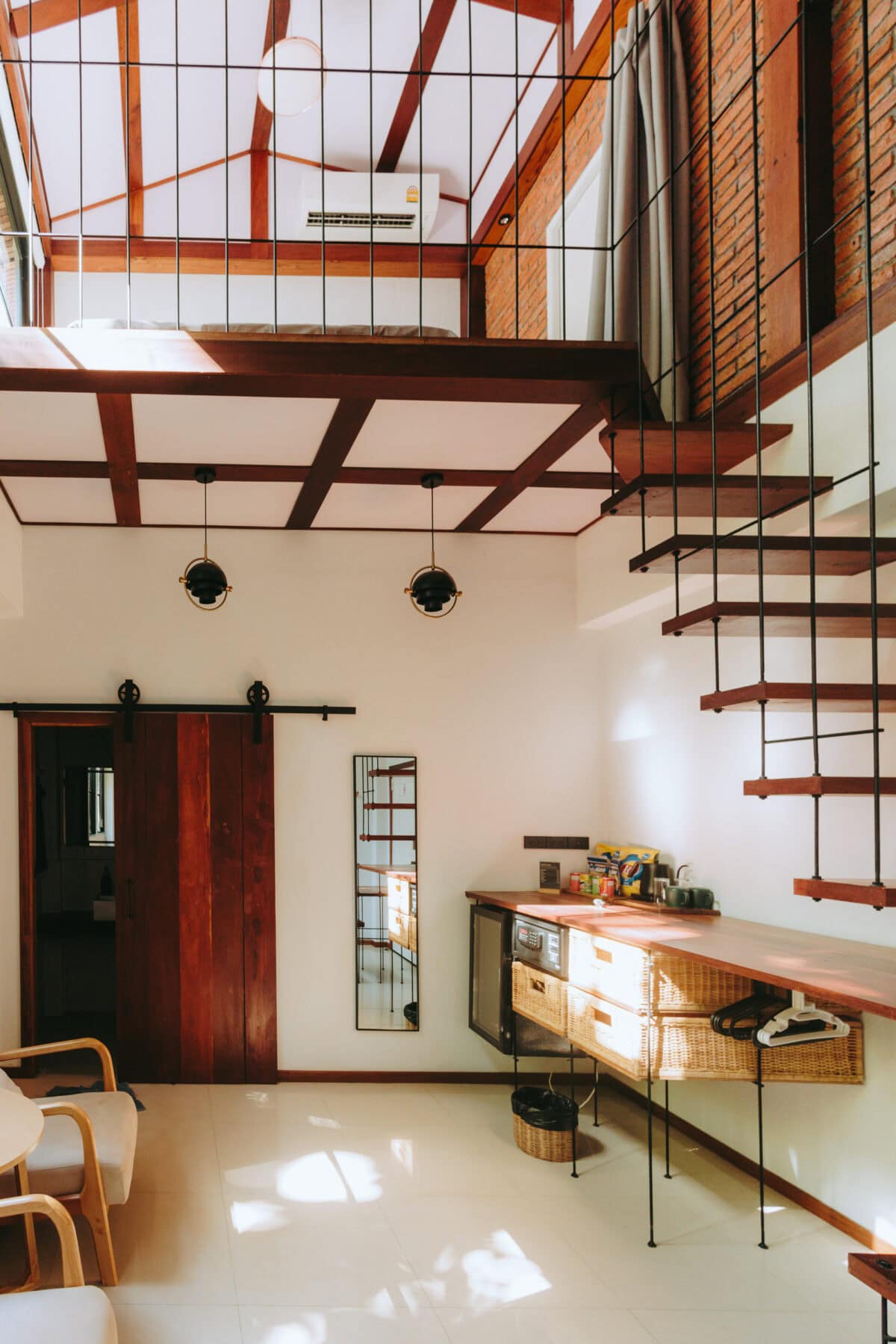 Modern loft with wooden staircase and gallery