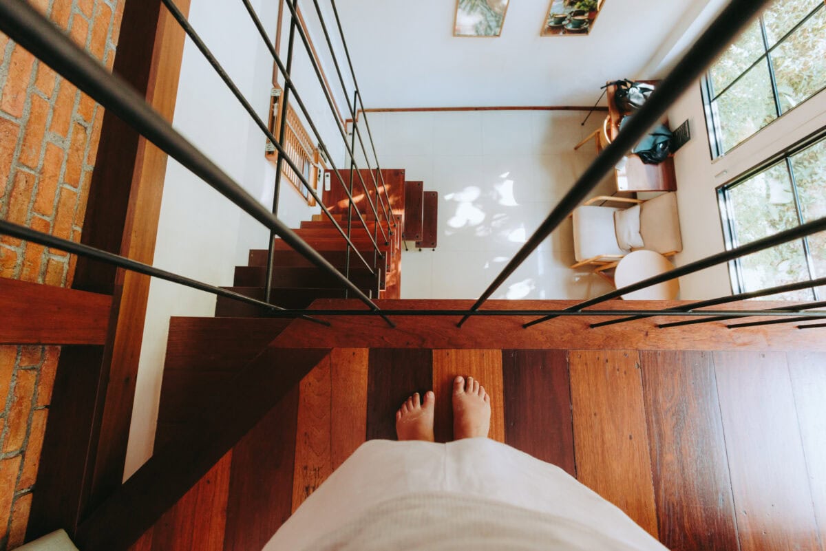 View from wooden staircase into modern living room