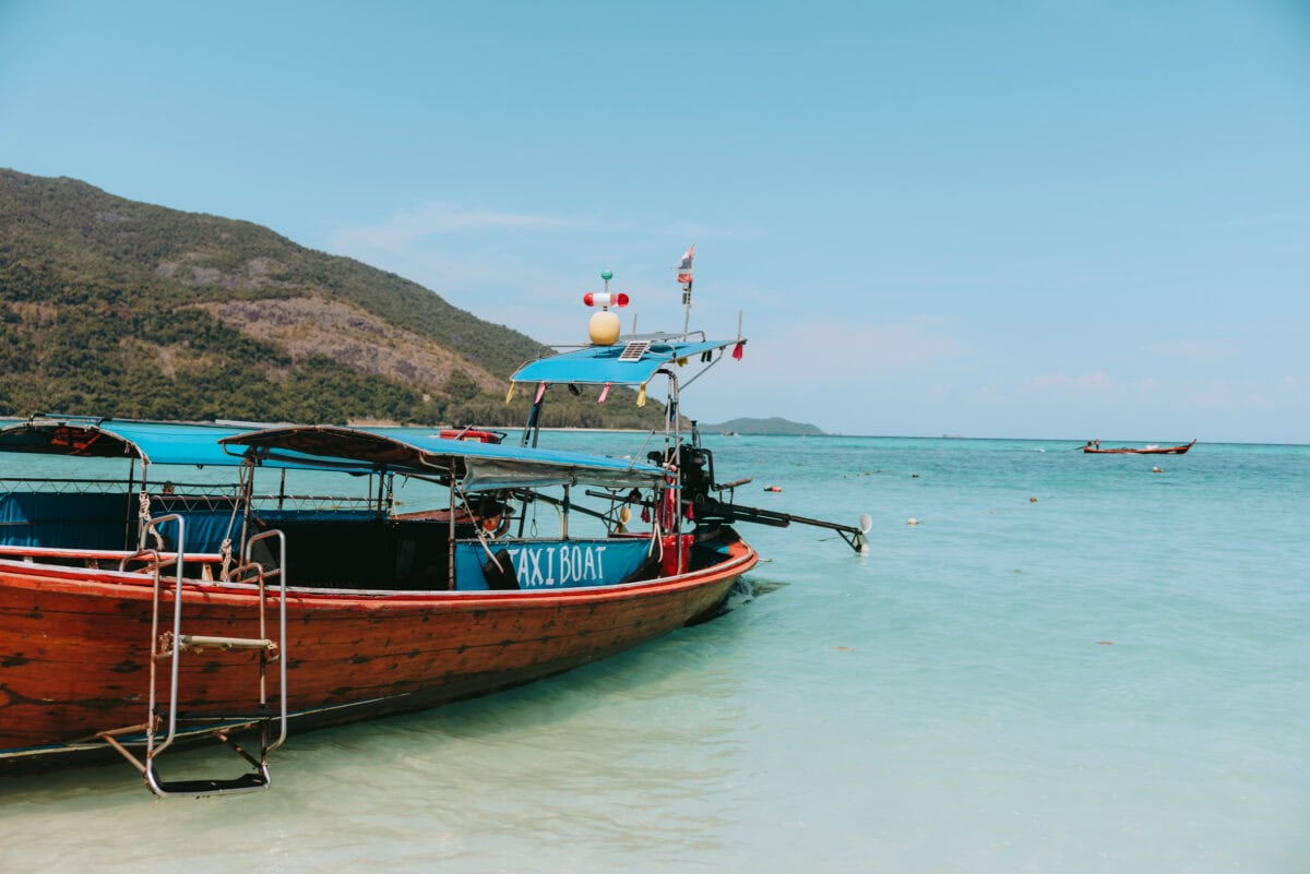 Wooden cab boat in the turquoise sea off the island