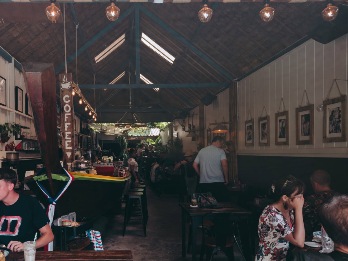 Cozy café with wooden roof and guests