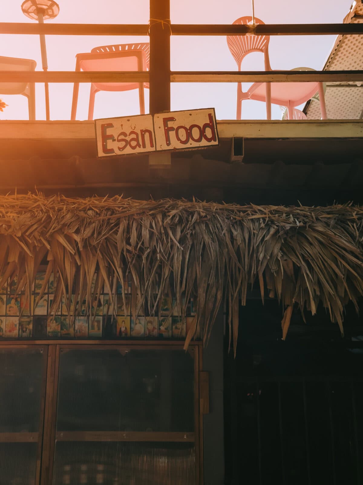 "Esan Food" sign on rustic snack stand