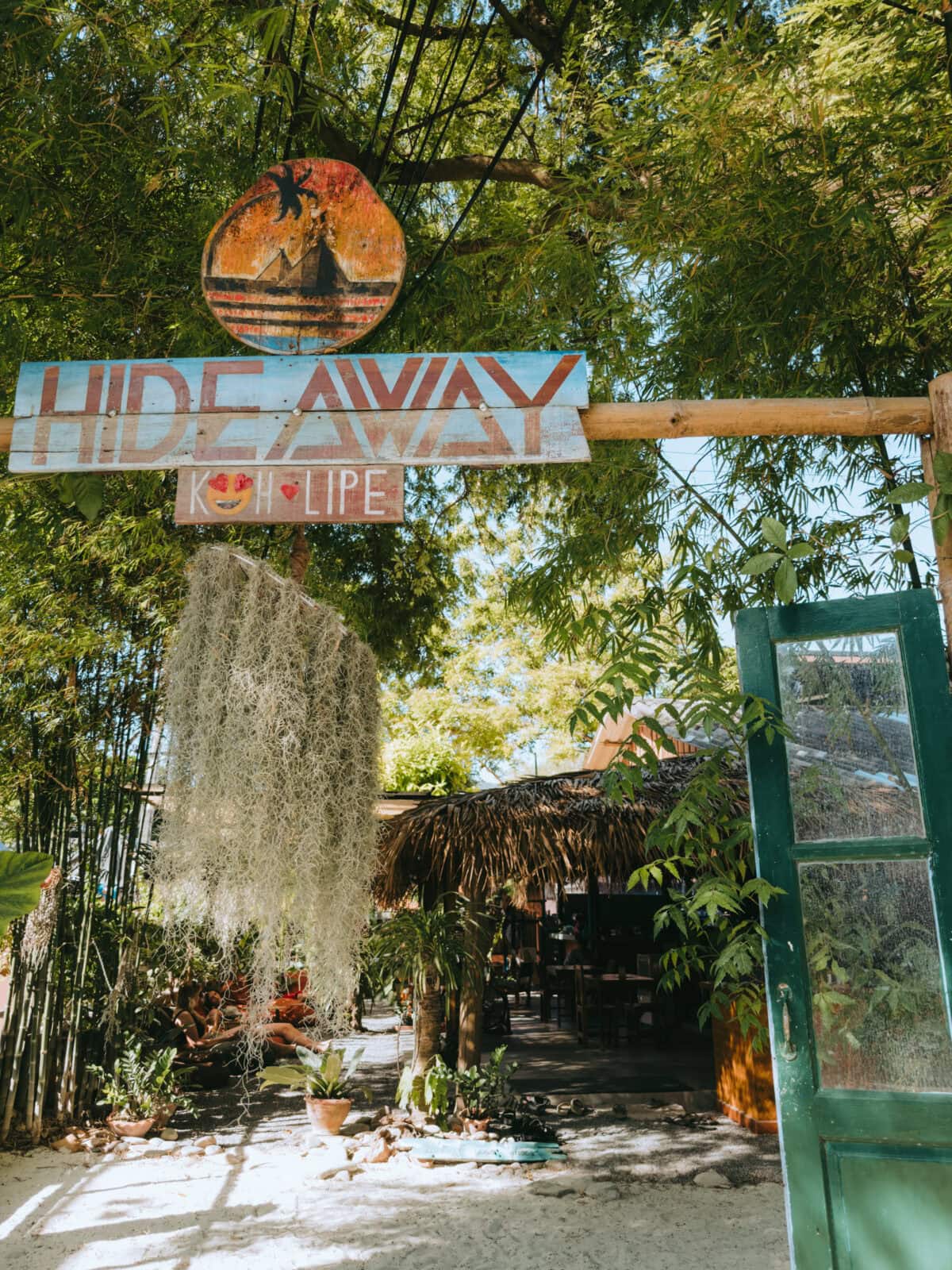 Wooden sign Hideaway Koh Lipe in the tropical garden